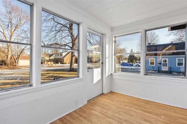 unfurnished sunroom featuring plenty of natural light