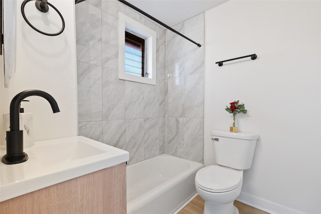 full bathroom featuring toilet, shower / bathtub combination, and vanity