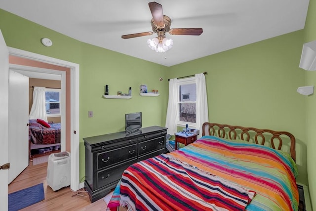 bedroom featuring ceiling fan and light hardwood / wood-style flooring