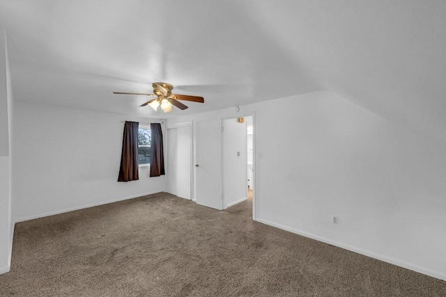 additional living space with lofted ceiling, ceiling fan, and carpet flooring