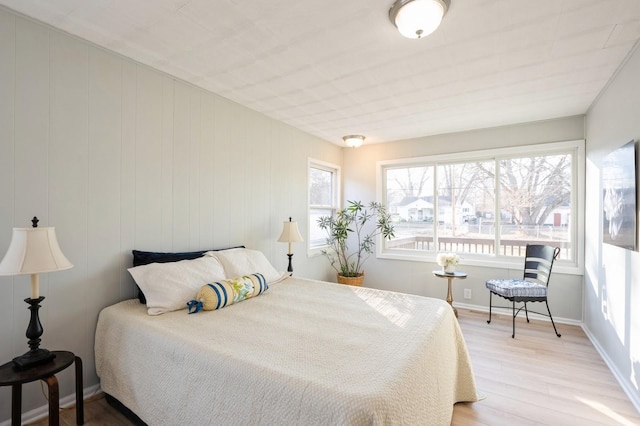 bedroom with light wood-type flooring