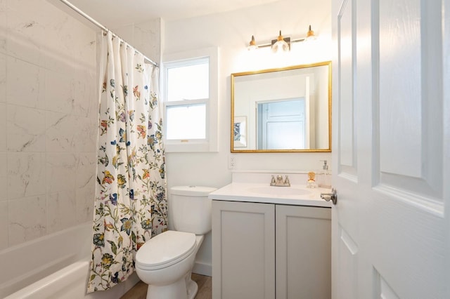 full bathroom featuring toilet, vanity, and shower / tub combo with curtain