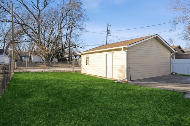 view of outbuilding featuring a yard