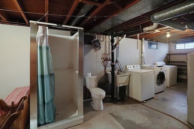 basement with washer and clothes dryer