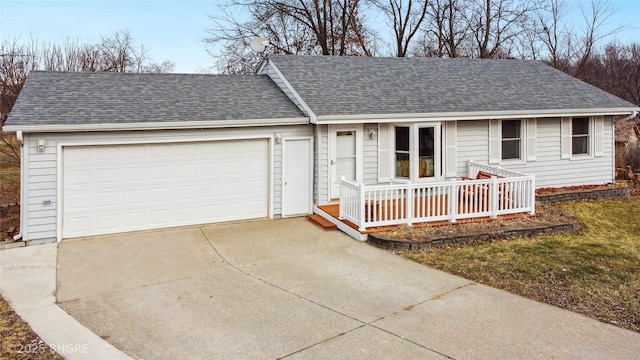 single story home with covered porch and a garage