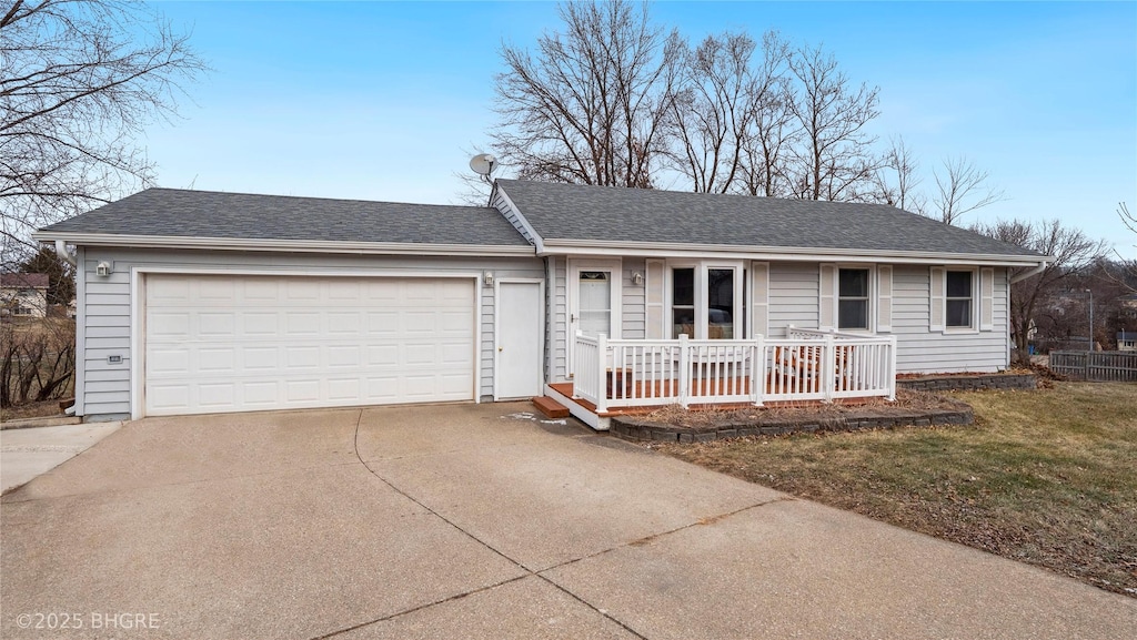 ranch-style house with covered porch and a garage