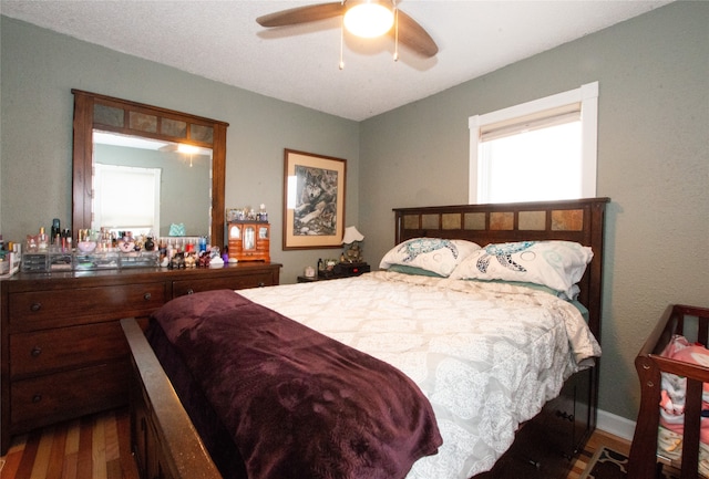 bedroom featuring ceiling fan and hardwood / wood-style floors