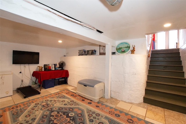 basement with light tile patterned floors