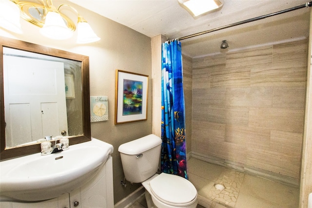 bathroom with toilet, vanity, and a shower with curtain