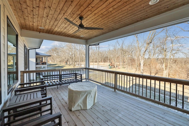 wooden terrace featuring ceiling fan