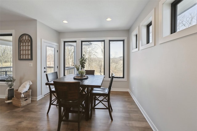 dining space featuring dark hardwood / wood-style floors