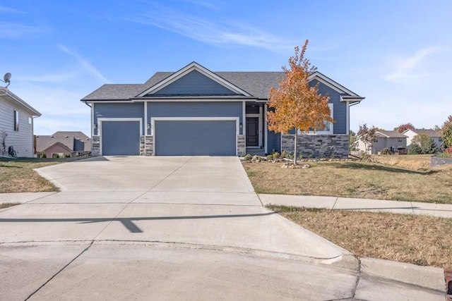 view of front facade with a garage and a front lawn