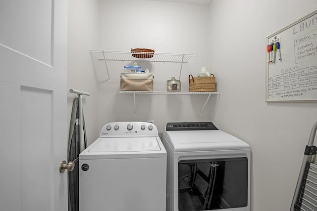 washroom with washer and clothes dryer