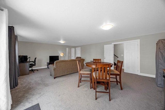 dining space featuring carpet floors