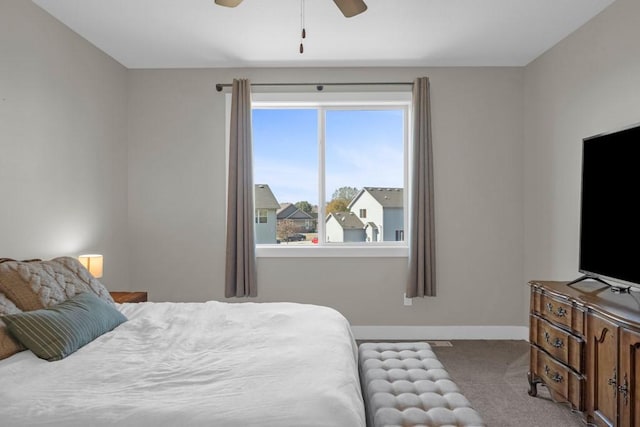 bedroom featuring ceiling fan and light colored carpet