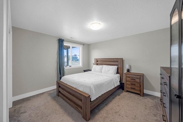 bedroom with light colored carpet