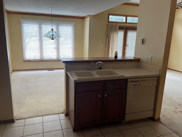 kitchen with light colored carpet, dark brown cabinetry, dishwasher, and sink