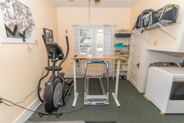 workout room featuring washer / clothes dryer and crown molding