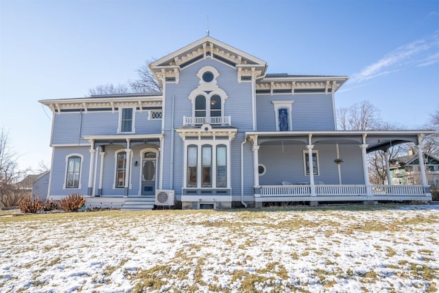 view of front of home featuring covered porch and a balcony