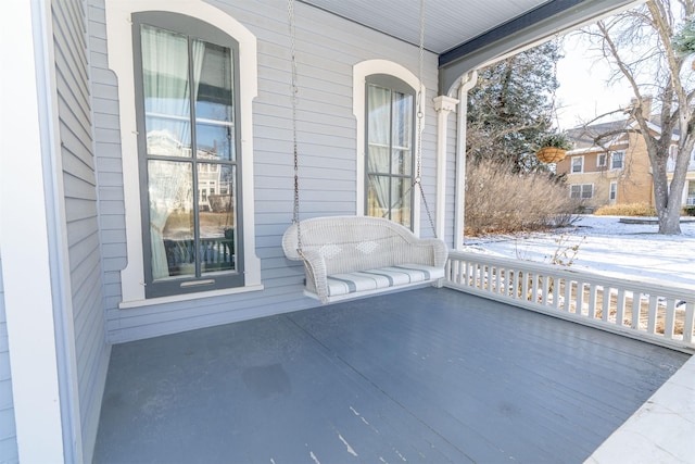 snow covered patio with covered porch