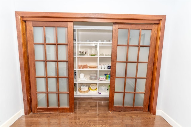 entryway with hardwood / wood-style flooring