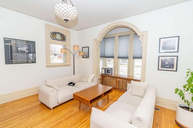 living room with light hardwood / wood-style flooring