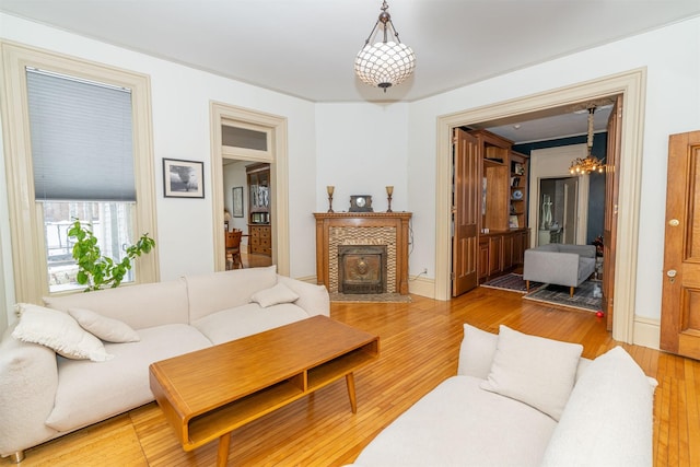 living room with a notable chandelier and wood-type flooring