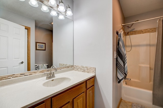 bathroom featuring tile patterned floors, vanity, and shower / bath combo