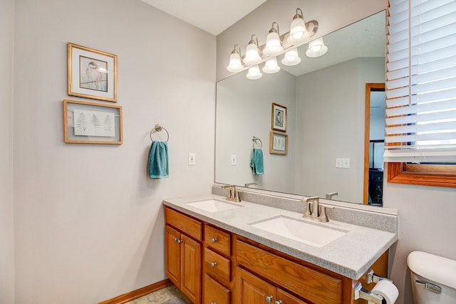 bathroom featuring vanity and toilet