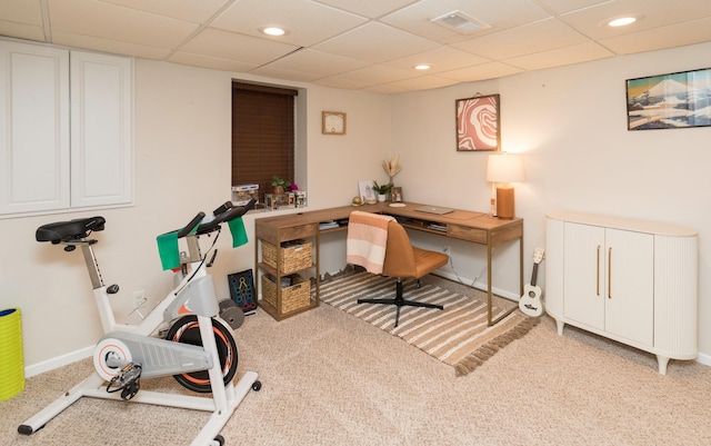 office area featuring radiator heating unit, a drop ceiling, and light colored carpet