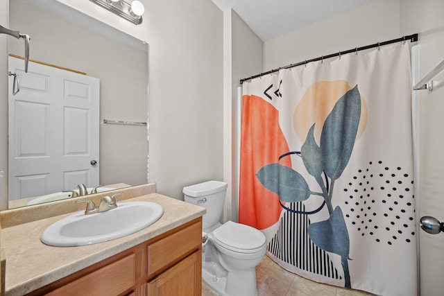 bathroom with a shower with curtain, tile patterned flooring, vanity, and toilet