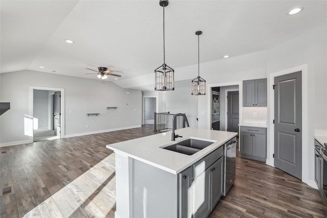 kitchen with sink, dishwasher, hanging light fixtures, gray cabinets, and a kitchen island with sink