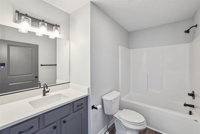 full bathroom with toilet, bathing tub / shower combination, and vanity