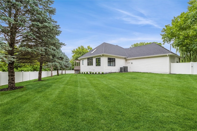 back of house with a lawn