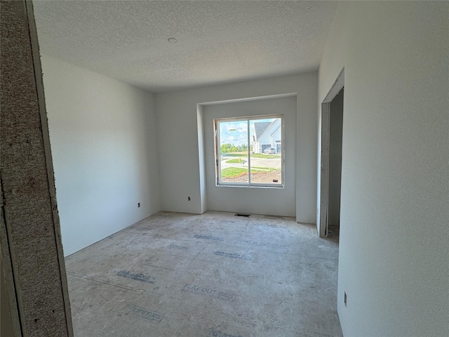 2909 Crest View Cir, Norwalk, IA 50211 - empty room featuring a textured ceiling