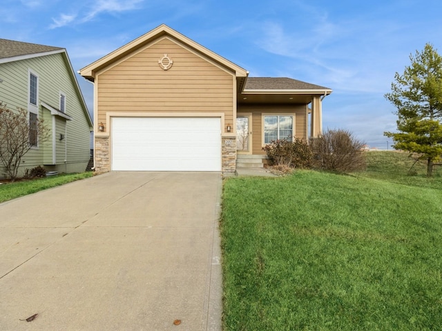 view of front of property with a front lawn and a garage