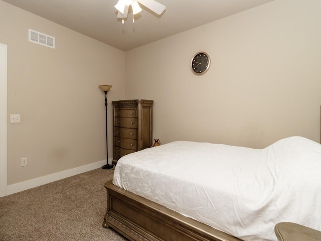 bedroom with ceiling fan and light carpet