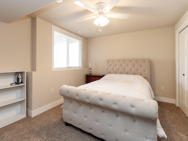 carpeted bedroom featuring ceiling fan