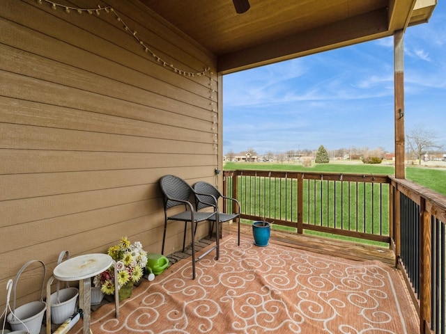 view of patio featuring ceiling fan and a wooden deck