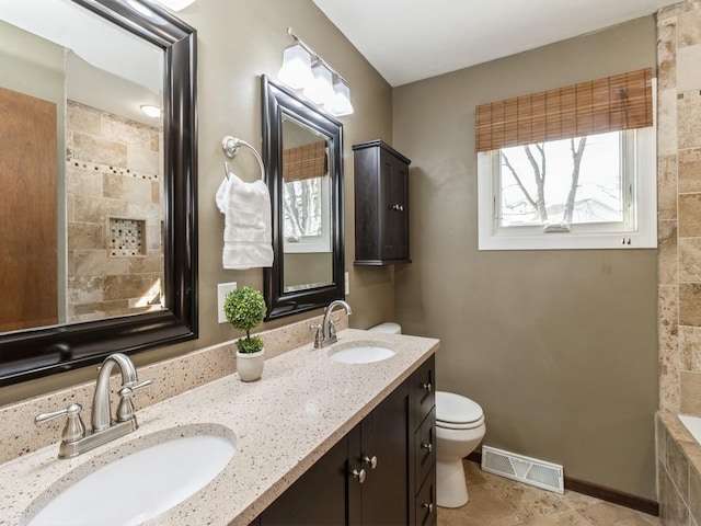 bathroom with vanity and toilet