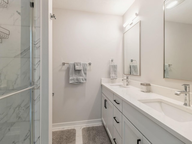 bathroom with walk in shower and vanity