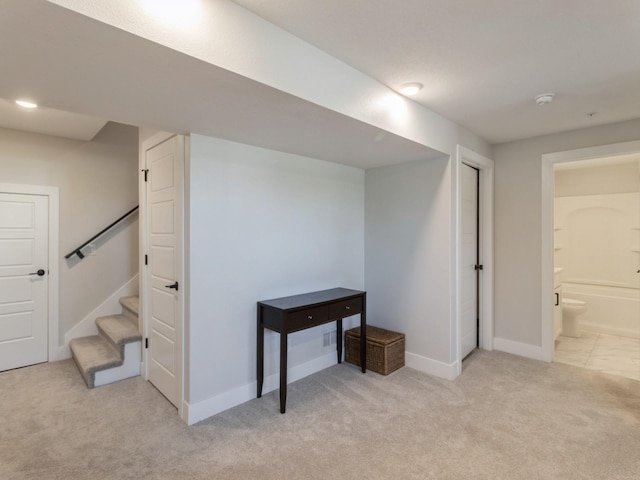 basement with light colored carpet