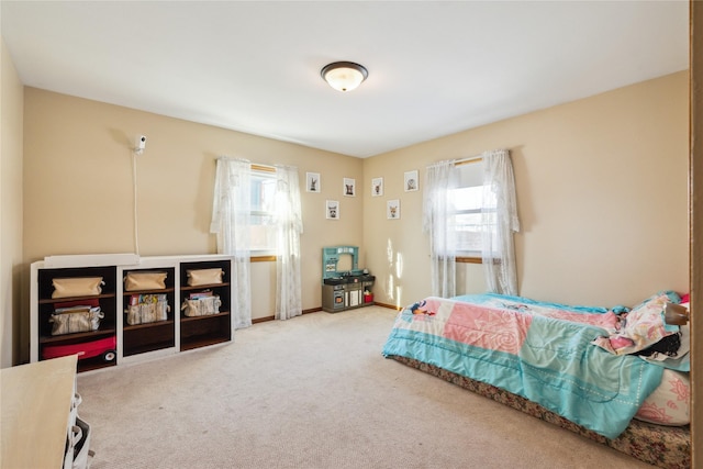 bedroom featuring multiple windows and carpet