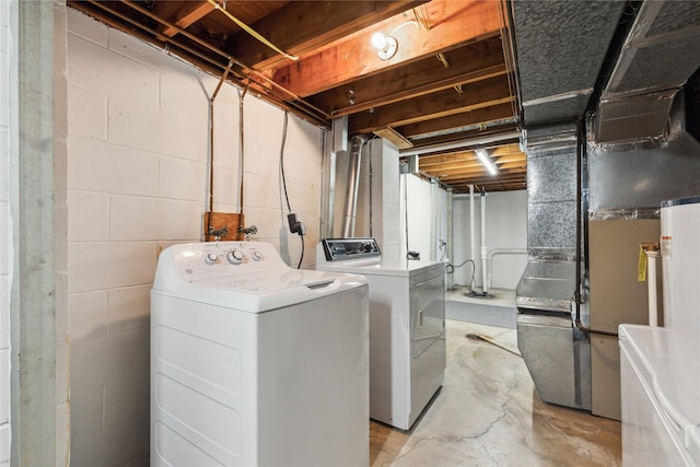 washroom with washing machine and clothes dryer