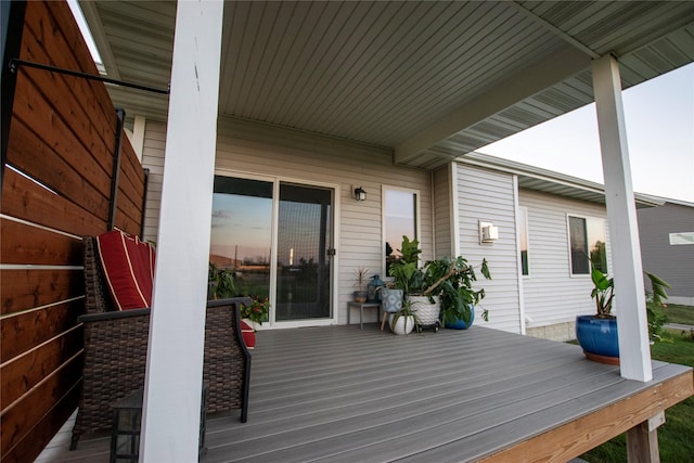 wooden terrace featuring covered porch