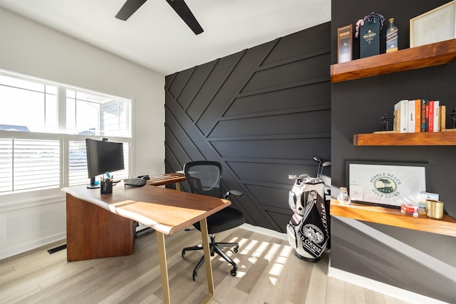 office space featuring ceiling fan and light hardwood / wood-style floors