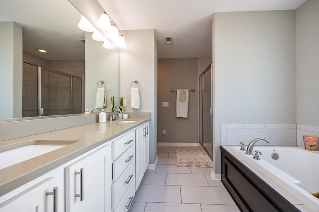 bathroom featuring tile patterned floors, independent shower and bath, and vanity