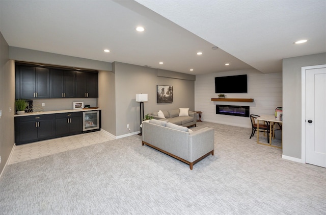 carpeted living room featuring indoor bar and wine cooler