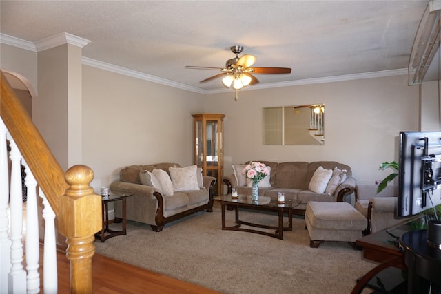 living room featuring ceiling fan, hardwood / wood-style flooring, and ornamental molding