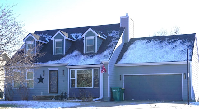 cape cod home featuring a garage